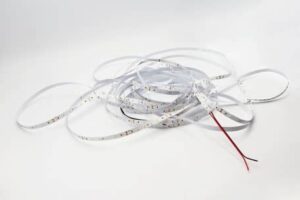 COB LED strip light installed under wooden sauna bench showing warm glow