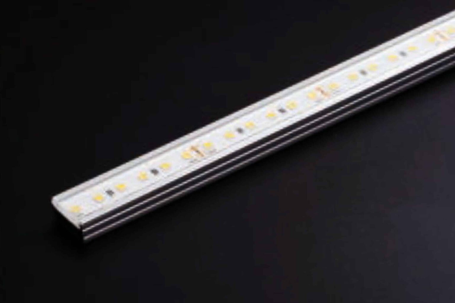 RLLAQU2 Neon Flex rigid LED pool light mounted on deck, glowing blue