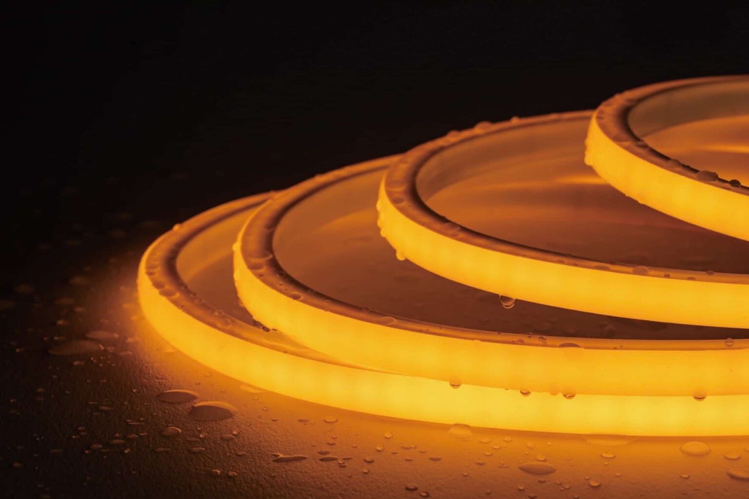 RHEA Neon Flex RLLNFTB1210 top‑bend silicone LED strip mounted along curved pool edge